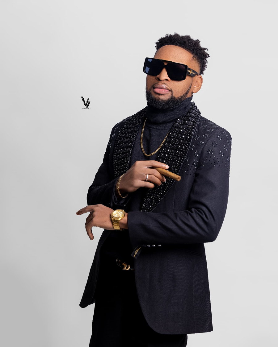 Studio portrait, black suit with crystal details
